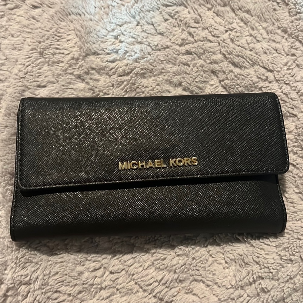 Black leather Michael Kors wallet.  Long